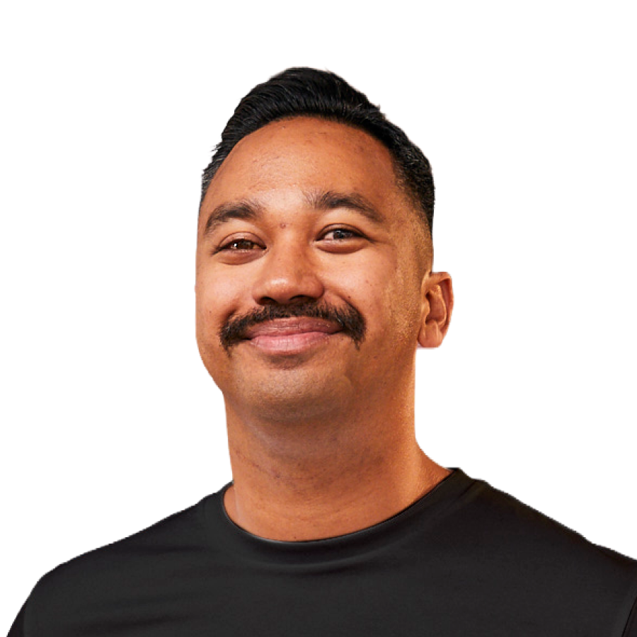 Photo of handsome man, sporting an excellent moustache, looking to camera. 