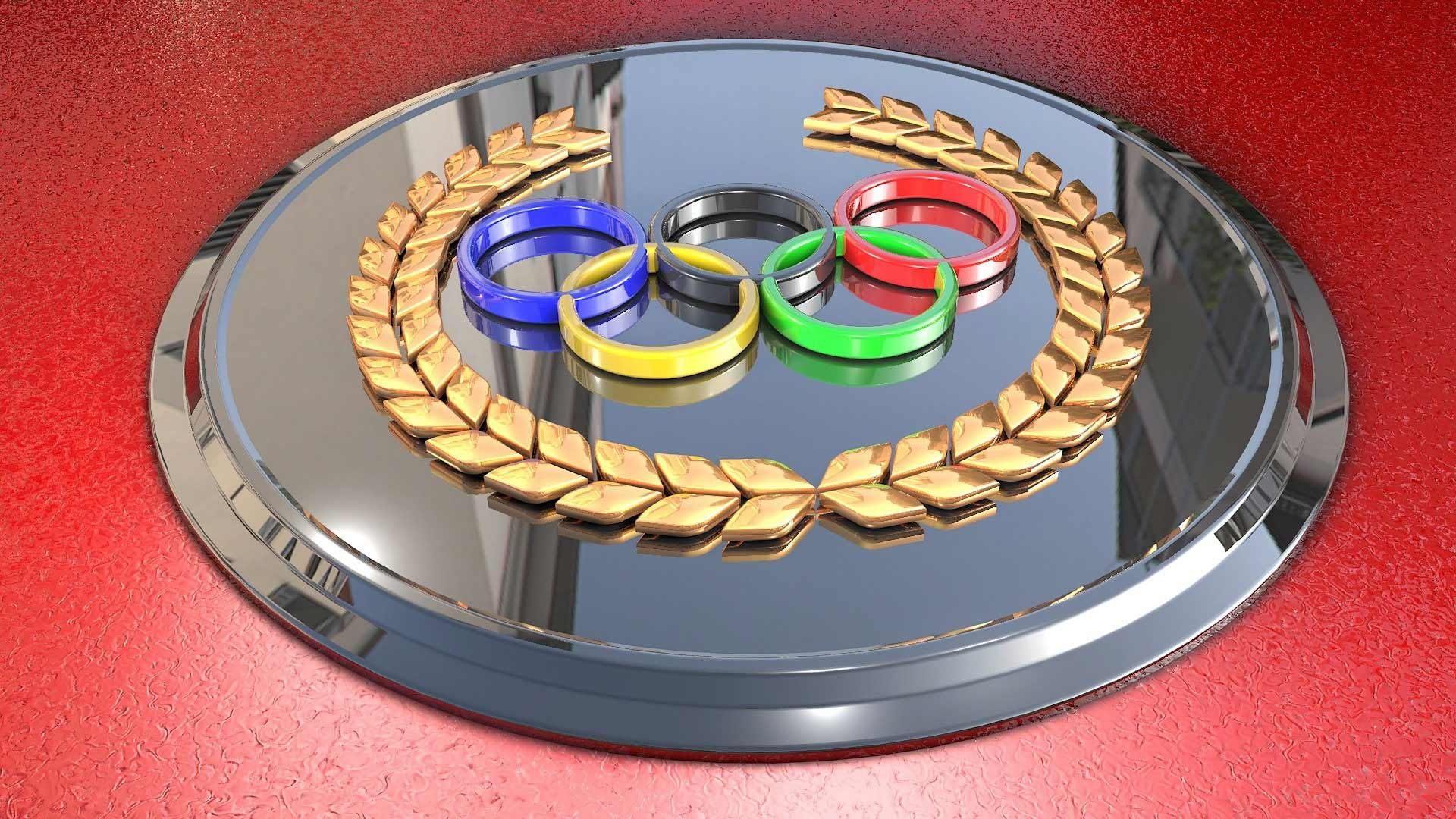 Photo of the Olympic logo embellished on a metal plaque.