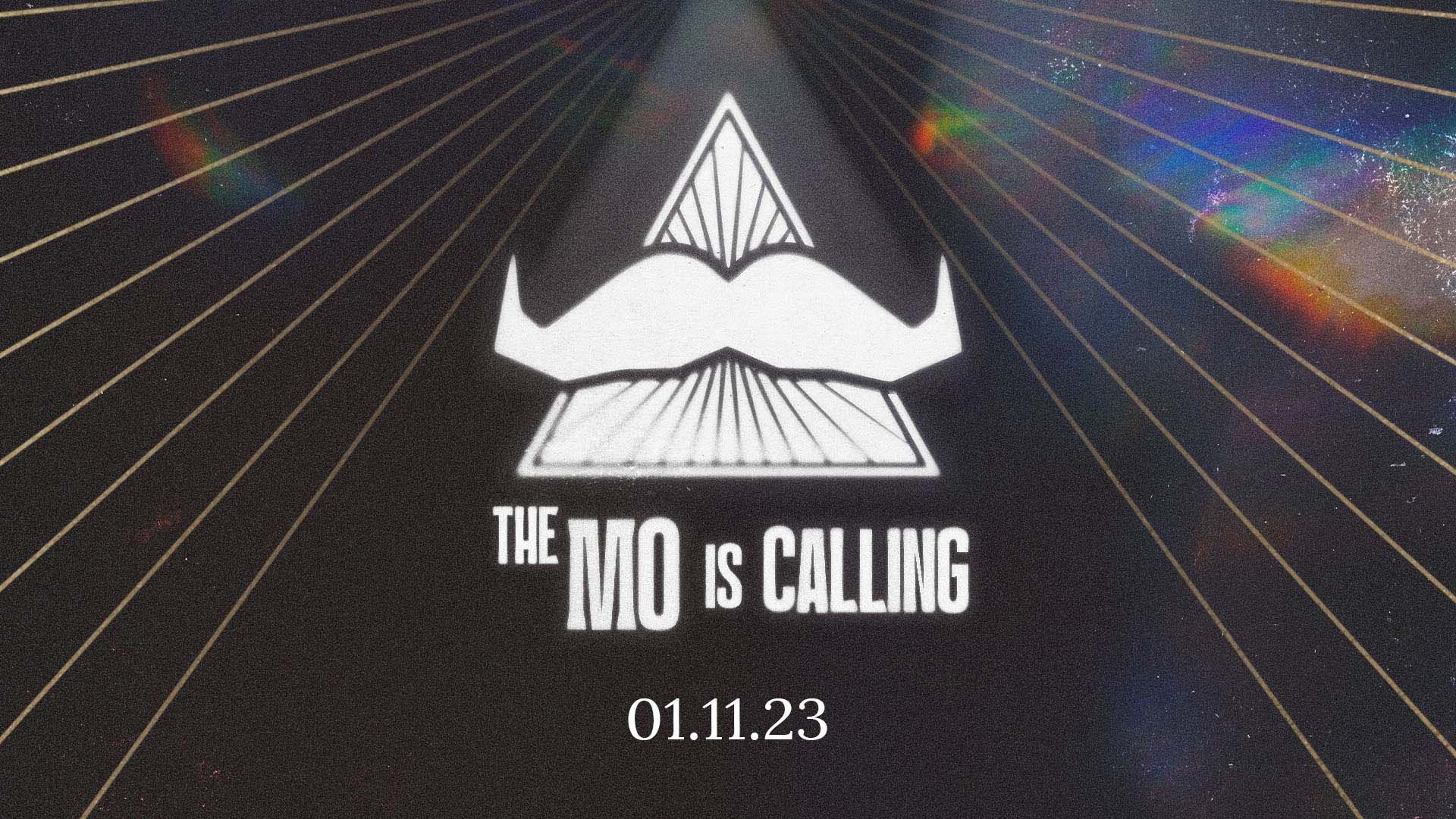 A stylised illustration of a moustache, surmounted on a mystical triangle. Superimposed text says: "The Mo Is Calling". It points to a date of November 1, 2023.