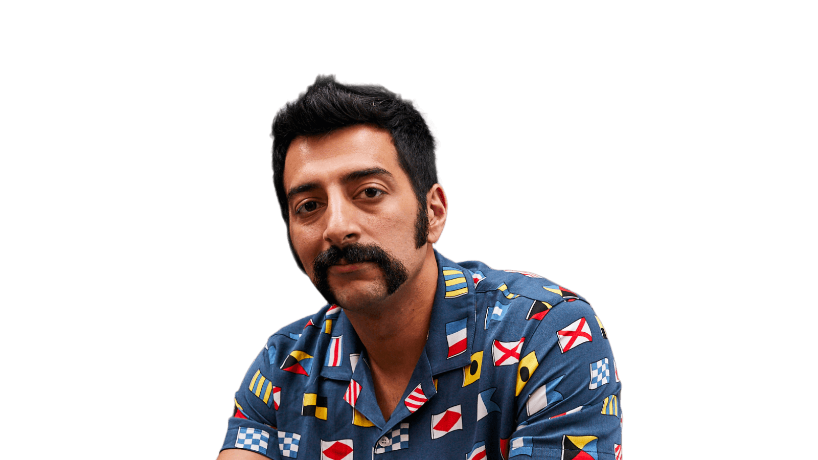 Photo of a handsome man, sporting an excellent moustache, looking attentively to camera.